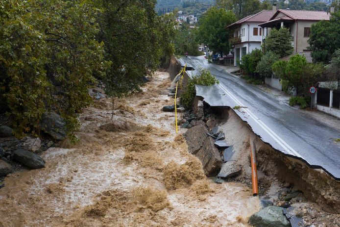 A road half destroyed by floods in Volos, central Greece.