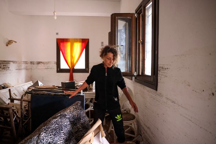 A woman inspects the damage to her guest house in Platanias, central Greece.