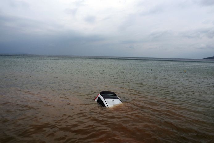 Milena's car half submerged.