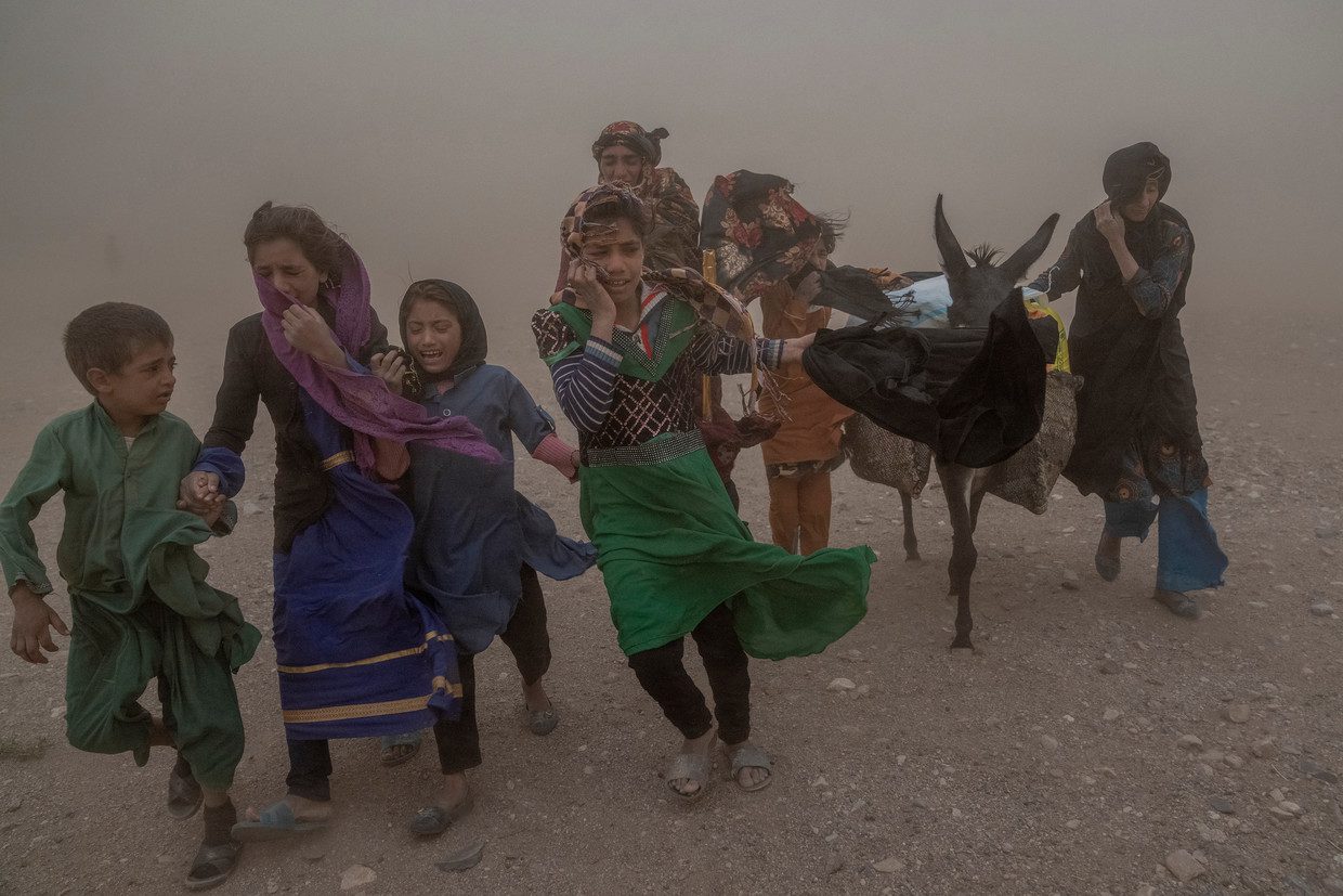 Girls and women fleeing in a sandstorm after an earthquake in Herat Province.  AP photo