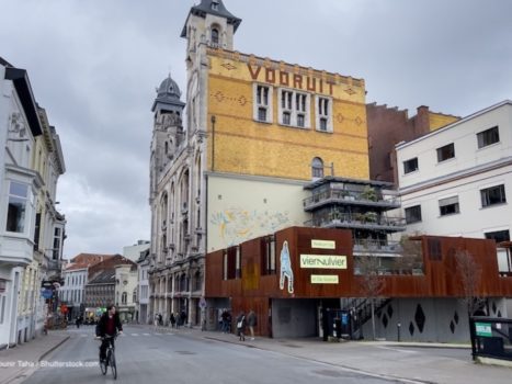 A large prescription appears on the facade of the Vooruit Building in Ghent