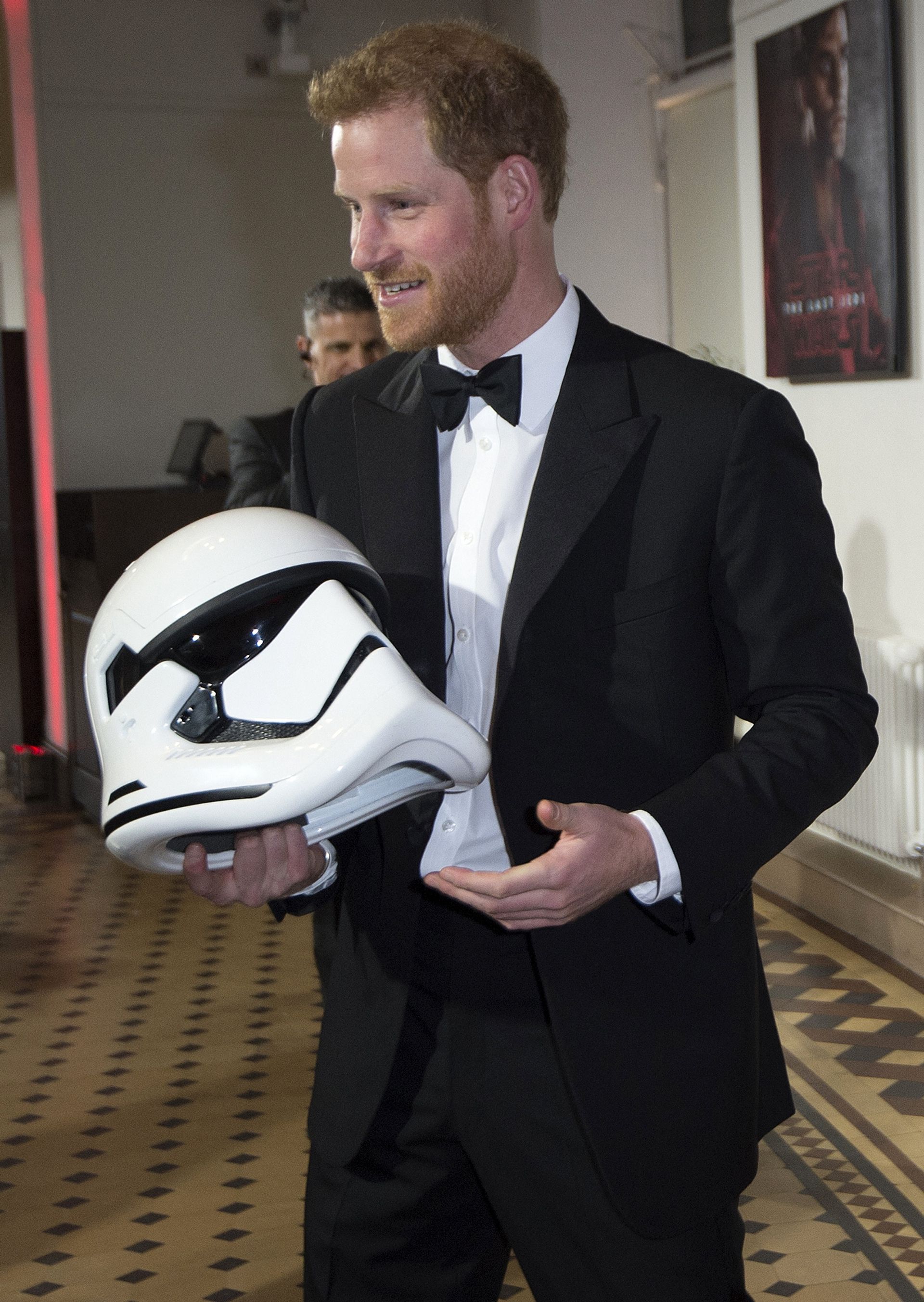 Prince Harry holds a stormtrooper helmet at the European premiere of Star Wars: The Last Jedi in 2017.