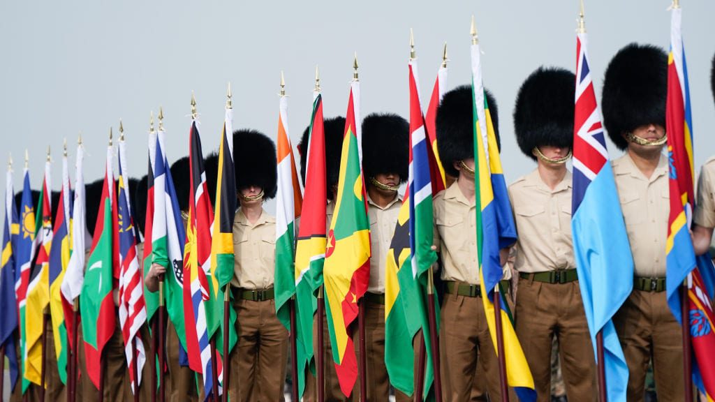 Coronation rehearsal. Flags of all Commonwealth countries parade.