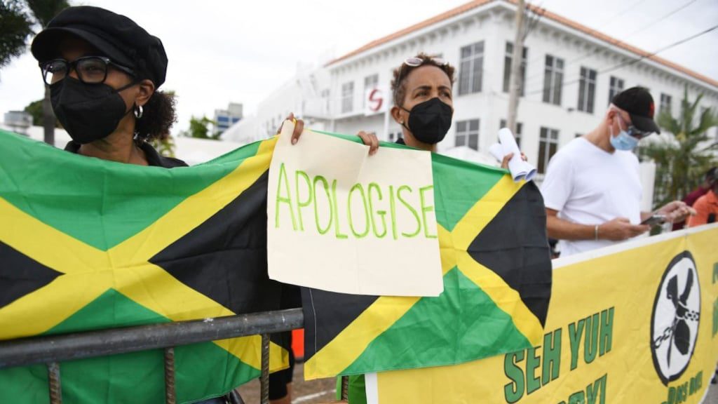 These Jamaicans want an apology from Prince Harry during his visit last year.